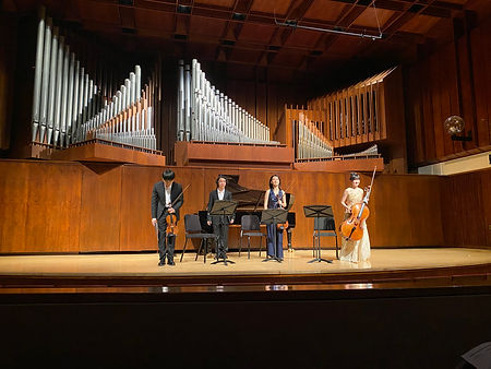 Jiahao Han in Paul Hall of Juilliard, with his Chausson Piano Quartet