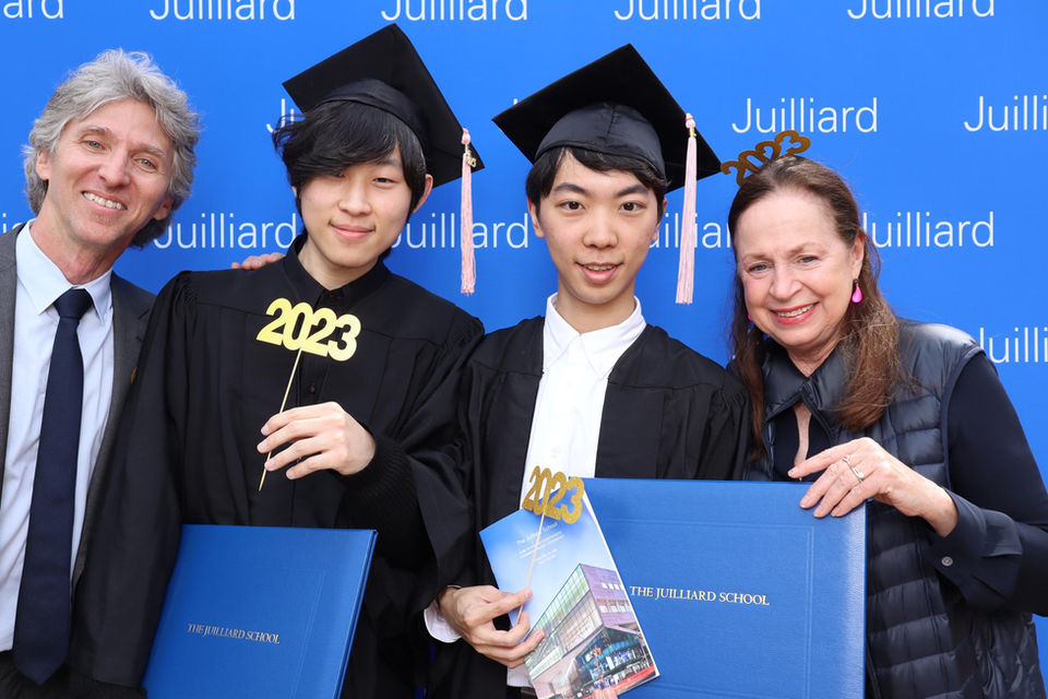Jiahao Han with Juilliard President Damian Woetzel and his wife at the Graduation Ceremony