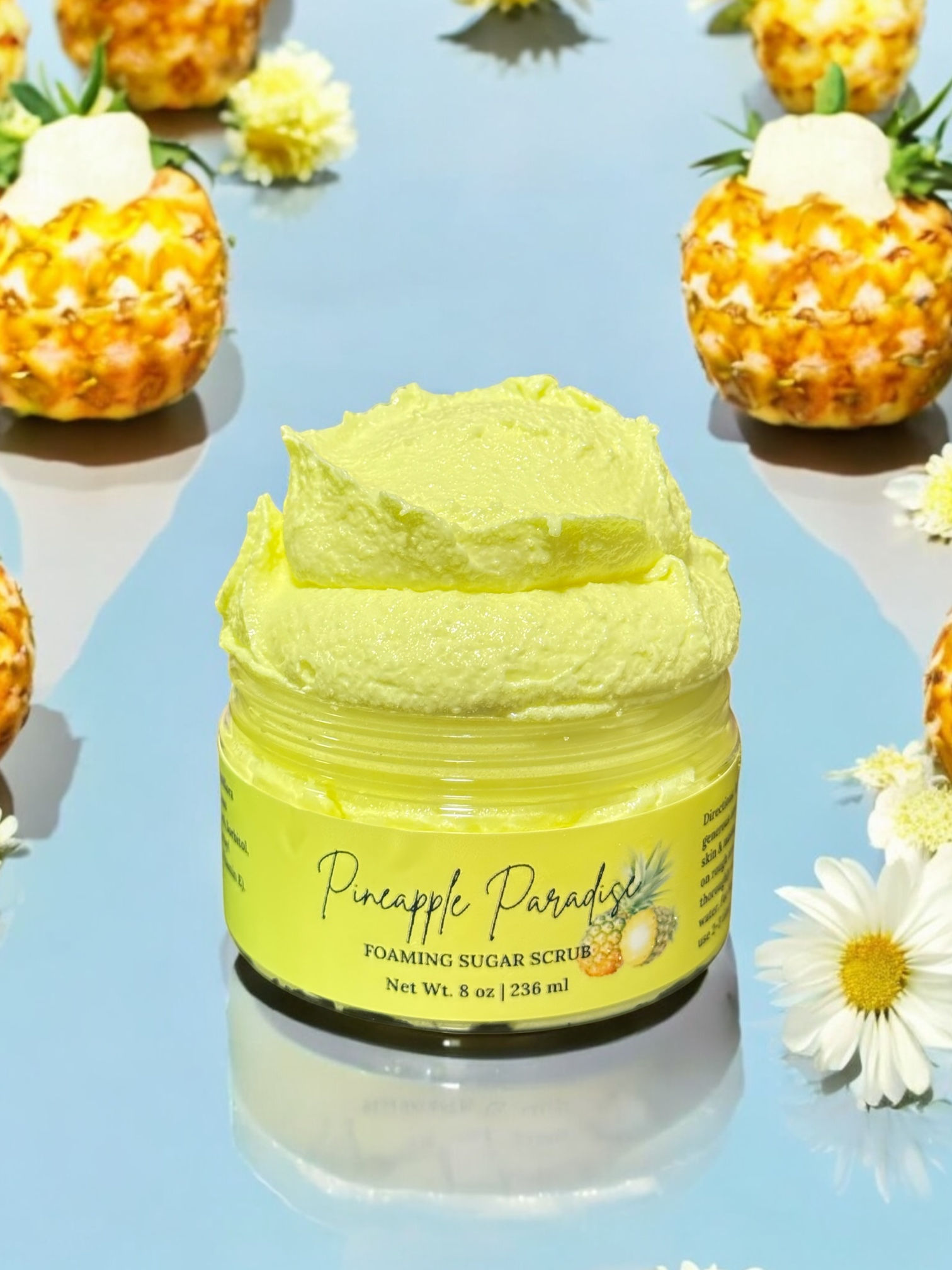 Pineapple Paradise Sugar Scrub in a jar, gently exfoliating and moisturizing skin with a tropical scent.