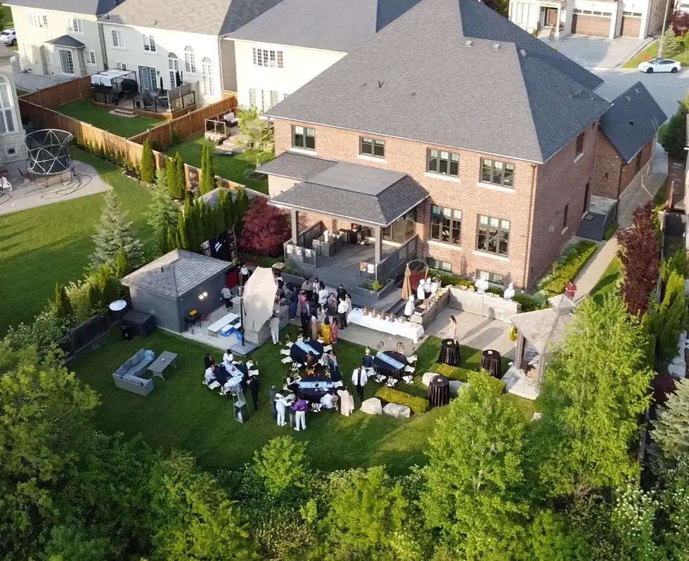 Aerial view of a luxury backyard event in the GTA catered by Khazana with professional live food stations