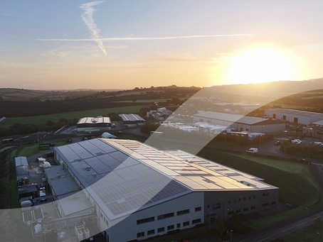 sunrise with solar on factory roof