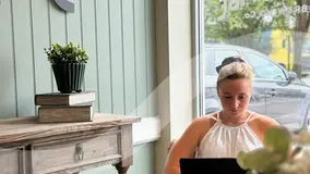 Rosie Robinson-Jones working on a laptop in an office