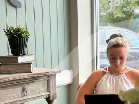 Rosie Robinson-Jones working on a laptop in an office