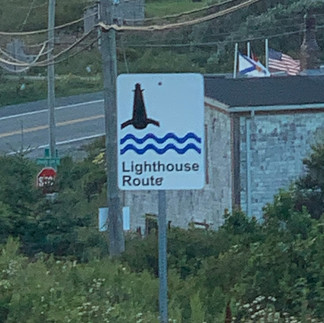 street sign indicating the lighthouse route