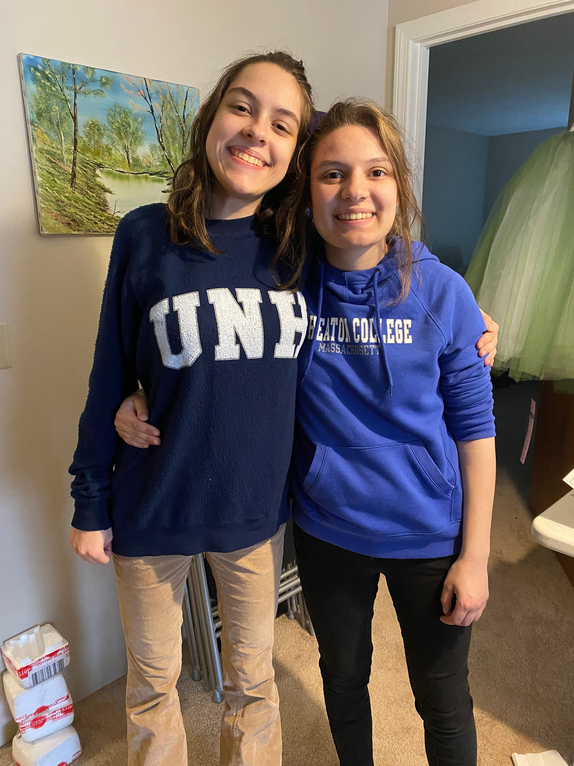 two girls in college sweatshirts