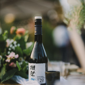 Close-up of Dassai sake, a premium Japanese sake made through a careful brewing process using rice, water, and koji.