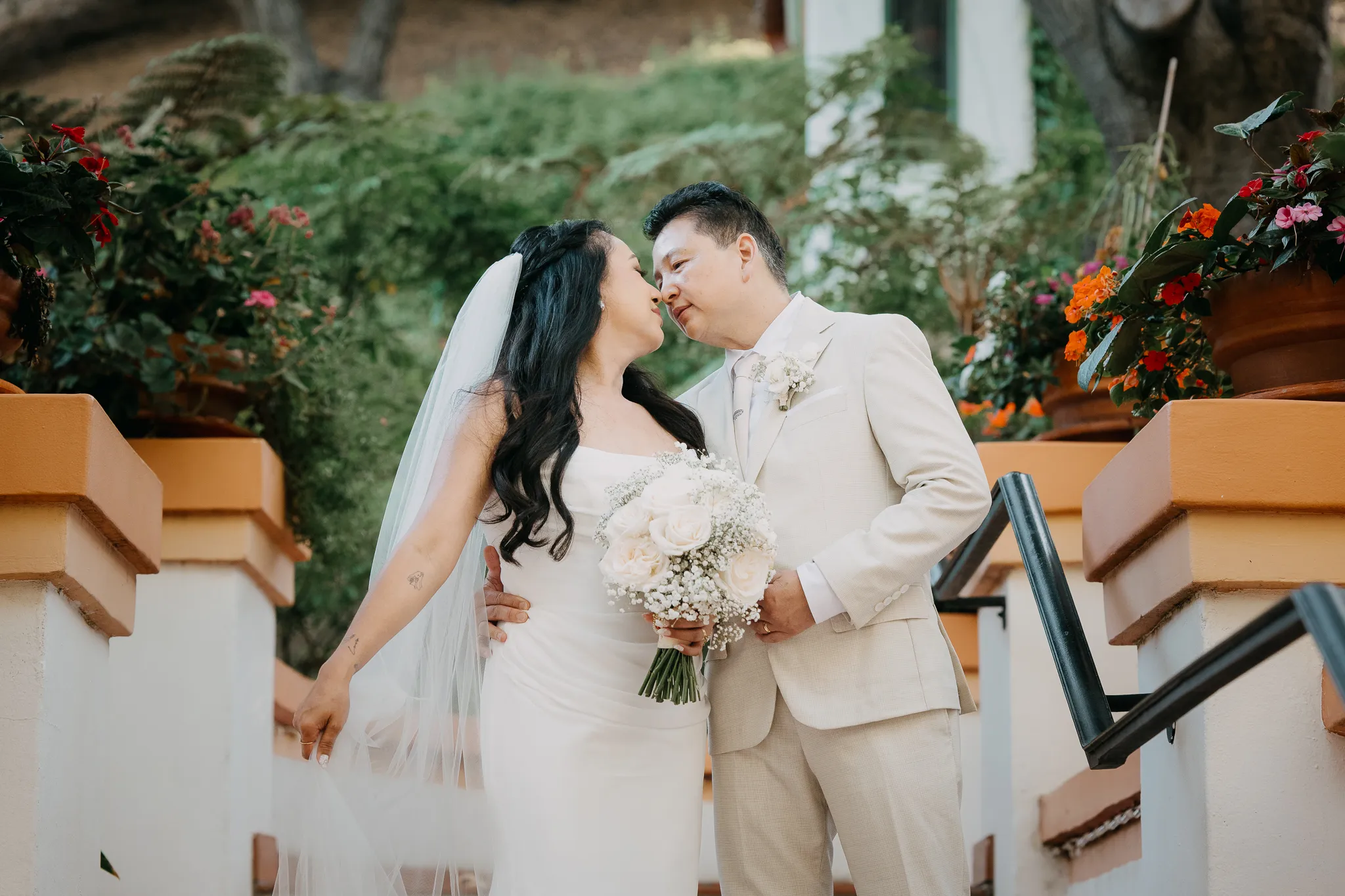 Bride and groom sharing a sweet pose during their wedding celebration.