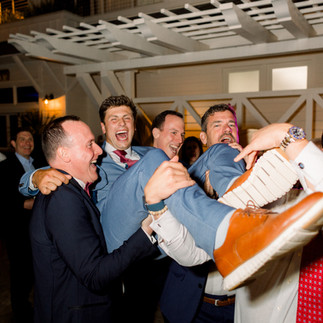 Groom having fun with his groomsmen.
