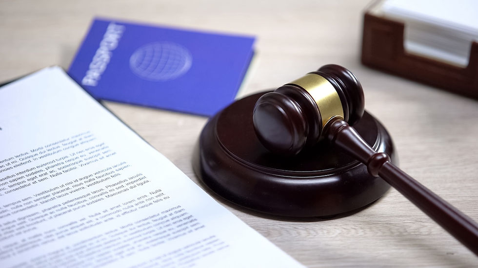 Gavel and passport on a desk representing the immigration consequences of a criminal conviction in Michigan.