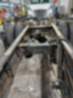 Semi-truck chassis in a repair shop