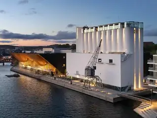 The artmuseum Kunstsilo in Norwegian Kristiansand seen from above at sunset.