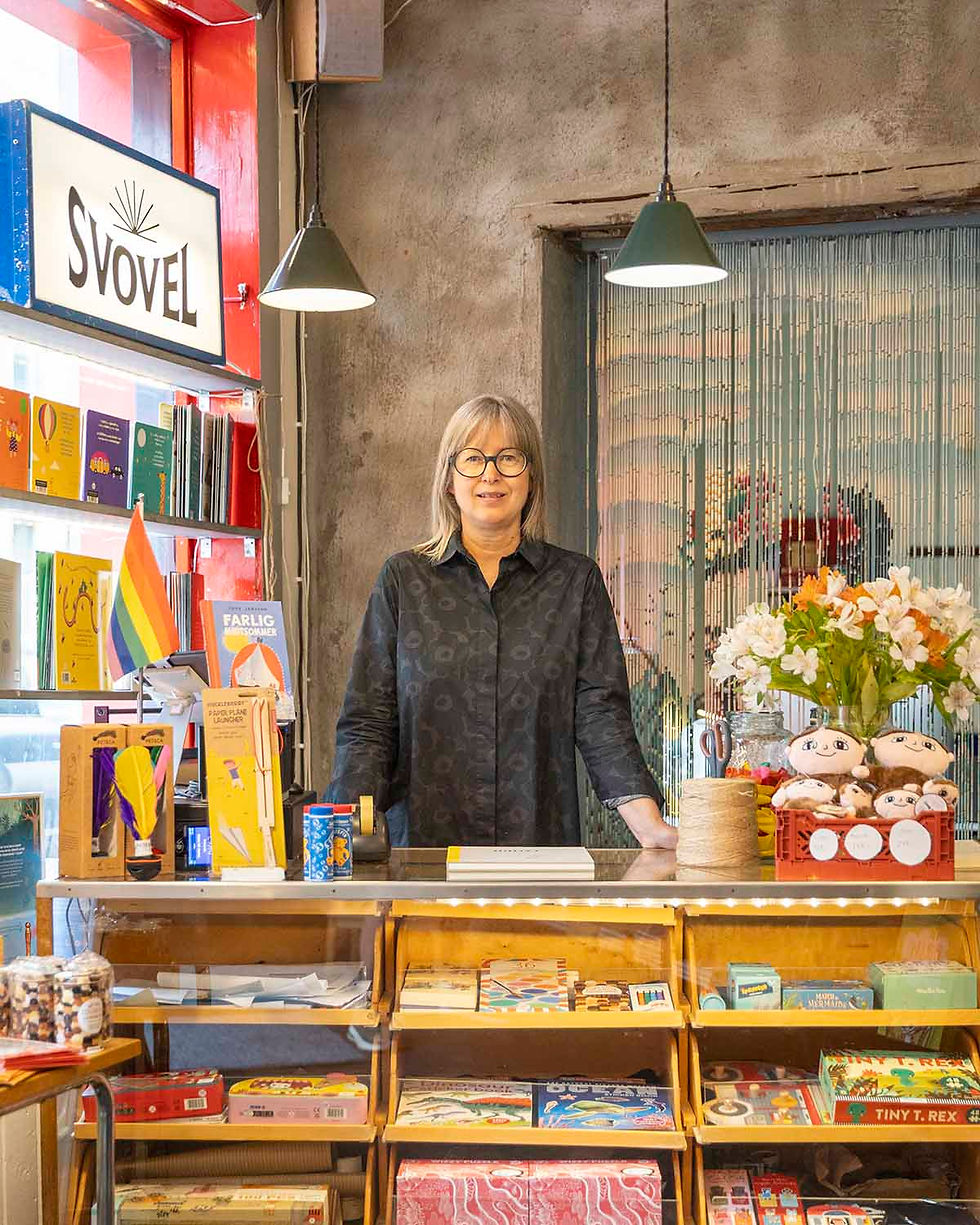 The owner of the children bookshop Svovel in Oslo, Ellen Renberg, is seen behind the till in the bookshop.