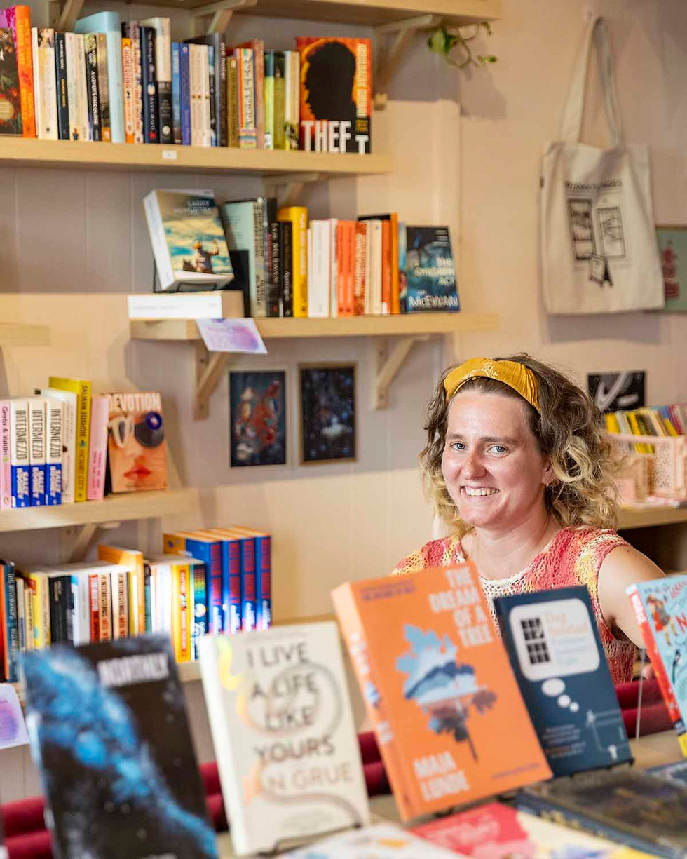 The owner of the all english bookshop Prismatic Pages in Oslo, Indigo Trigg-Hauger, is seen in the bookshop.