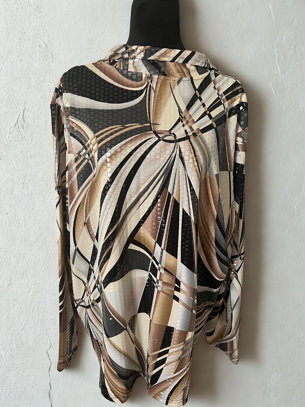 Geometric print zip-up jacket displayed. Creme/Black Sequin Jacket, Gold Sweater w/Calvin Klein Cooper/Black Pump 10.