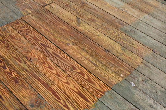 Pressure washing a deck in Virginia Beach