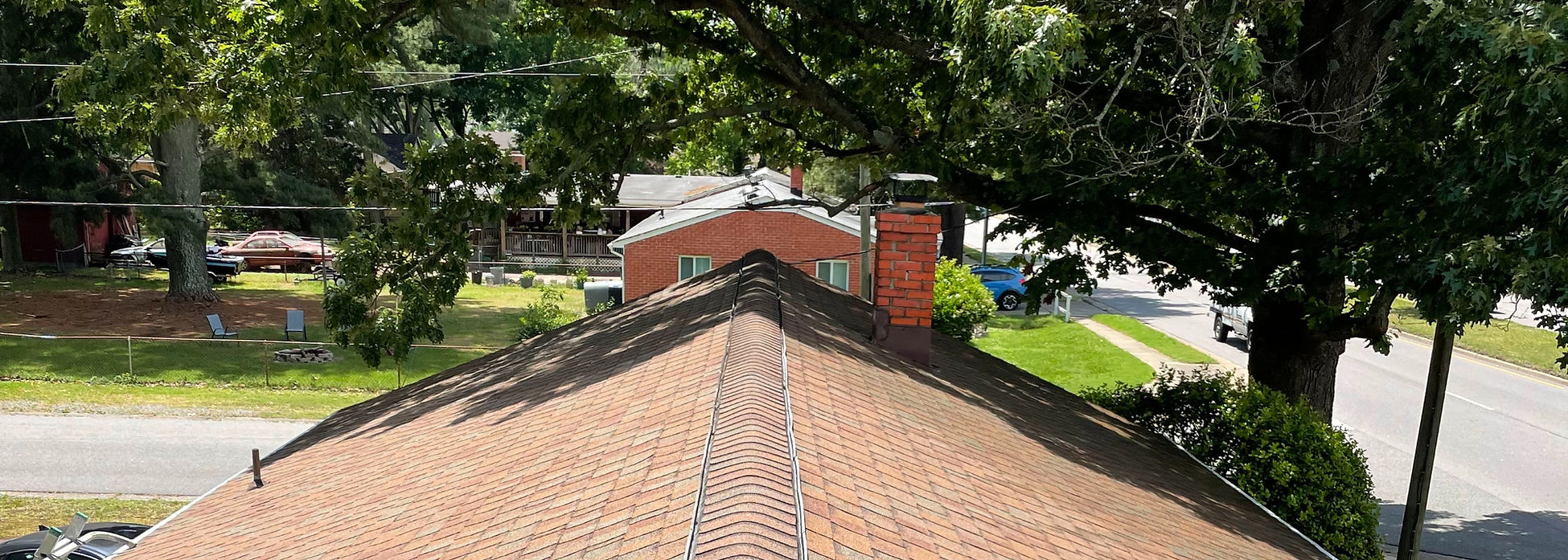 Freshly pressure washed roof on a residential home in Virginia Beach, showing clean shingles and restored curb appeal