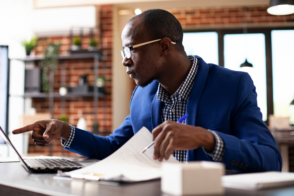 Business leader reviewing documents and giving direction during a work task