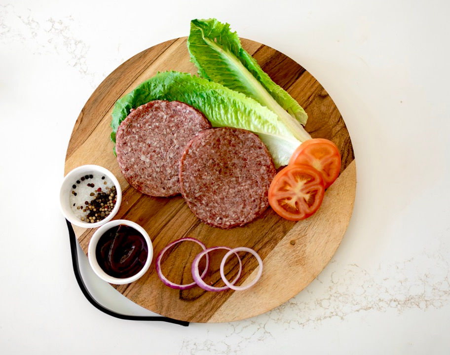 Burger Patties on cutting board at Benner Beef