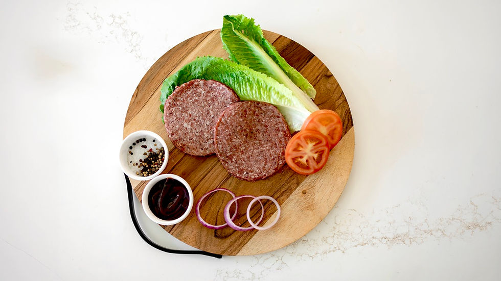 Burger Patties on cutting board at Benner Beef