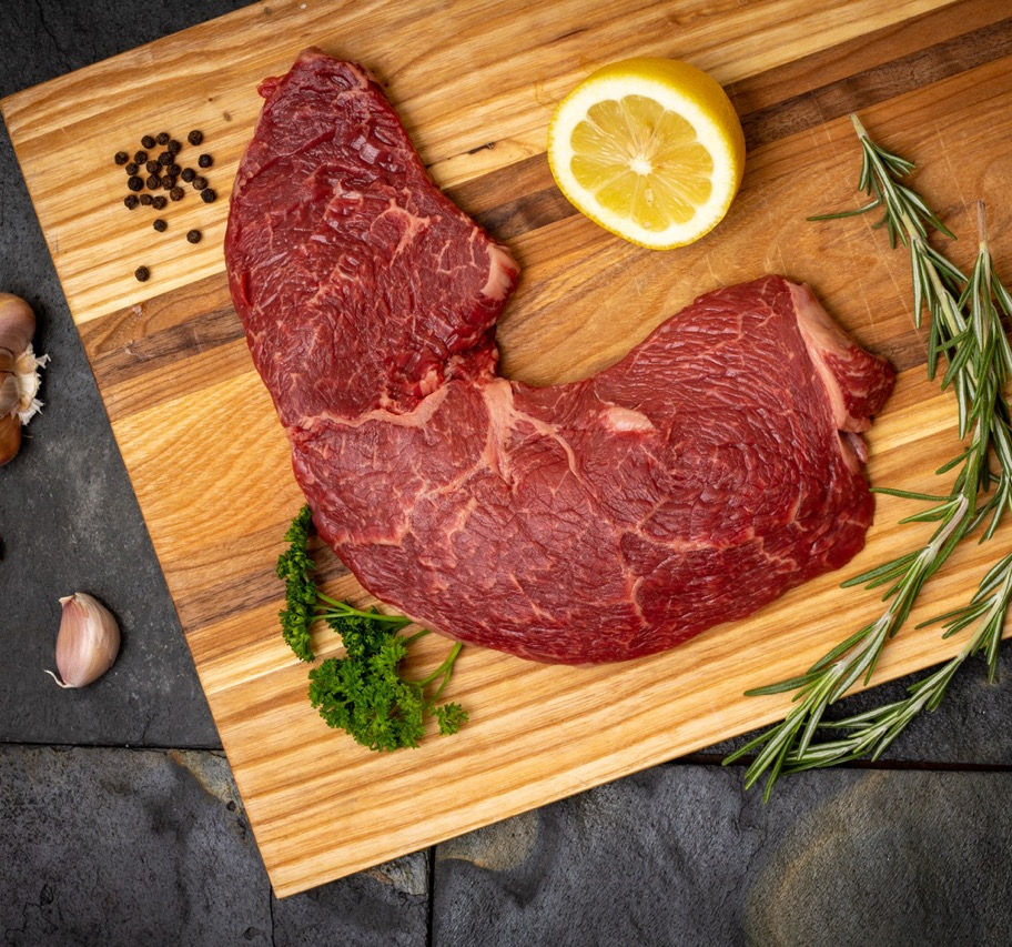Wagyu Sirloin Steak on wooden cutting board at Benner Beef