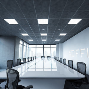 Modern conference room with a long white table, black chairs, large windows showing cityscape. Wall reads "OFFICE." Bright, sleek atmosphere