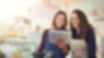 happy workers looking at a screen