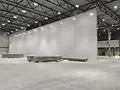 whitewall partition in a large warehouse.webp