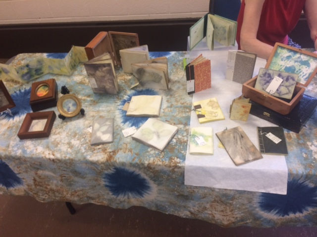 Artist Kathleen Kelly with her books and other creations
