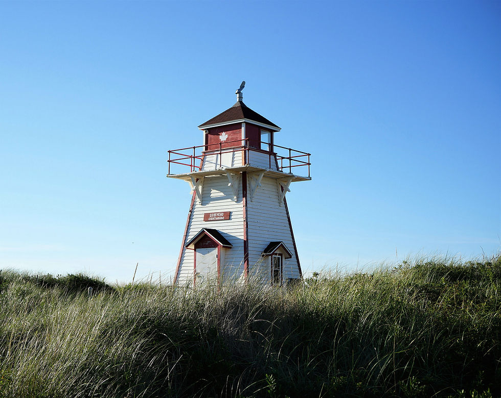 Small white and red lighthouse in Prince Edward Island Canada