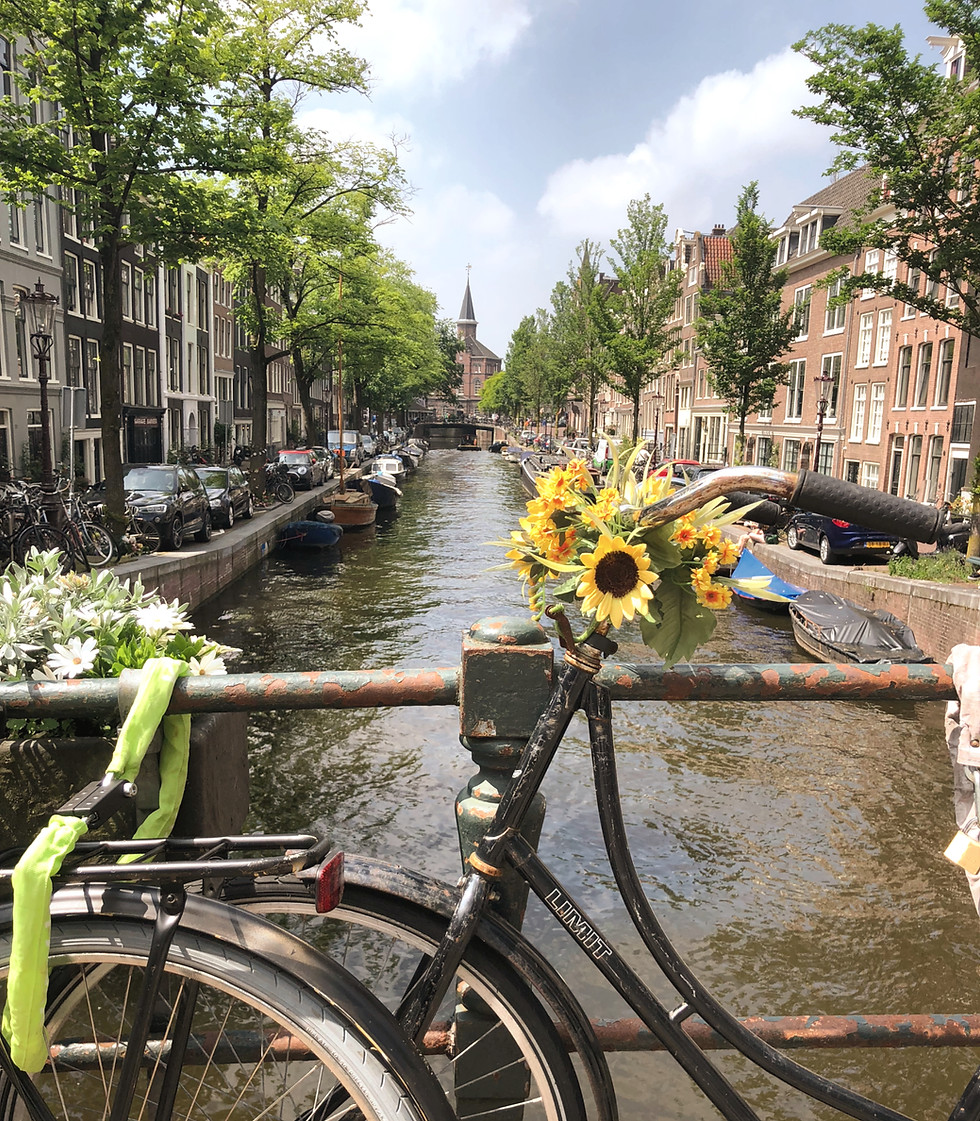Bike on canal in Amsterdam