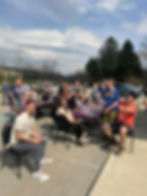 Large group of residents and employees at Penn Residential gathered in a photo during an outdoor summer event.