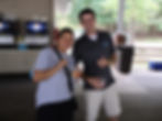 Penn Residential employee and resident smiling together for a photo under a pavilion at Idewild Park.