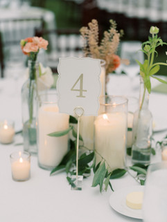 Budvase and candle centerpiece for wedding