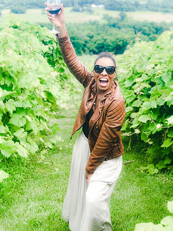 Raising a glass of wine to celebrate staying positive