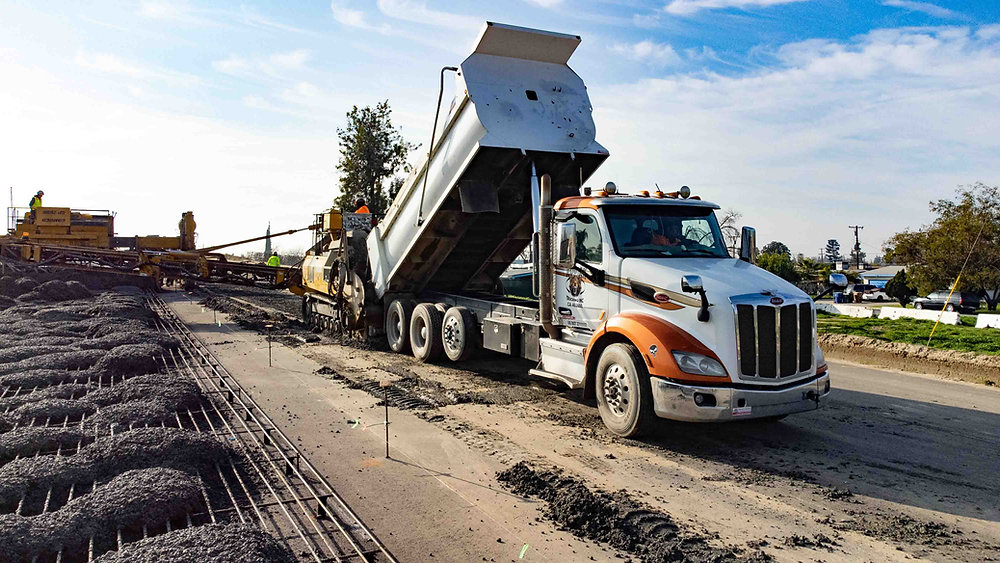 What is a Super Dump Truck? Exploring Variations and Their Roles in
