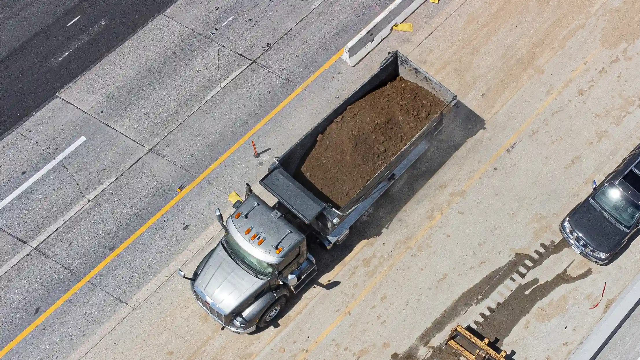 top-down-drone-pic-of-truck-with-dirt.webp