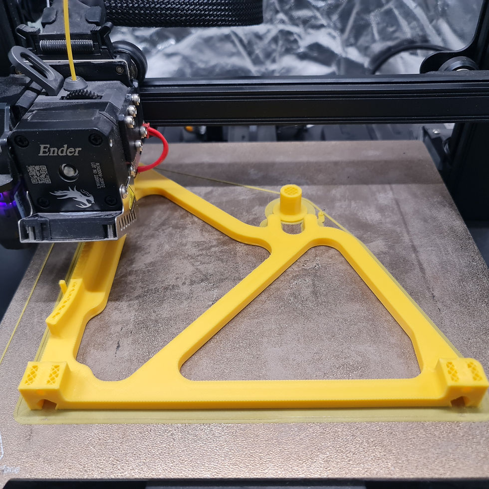 A 3D printer making a yellow object