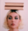 women with two books balanced on her head