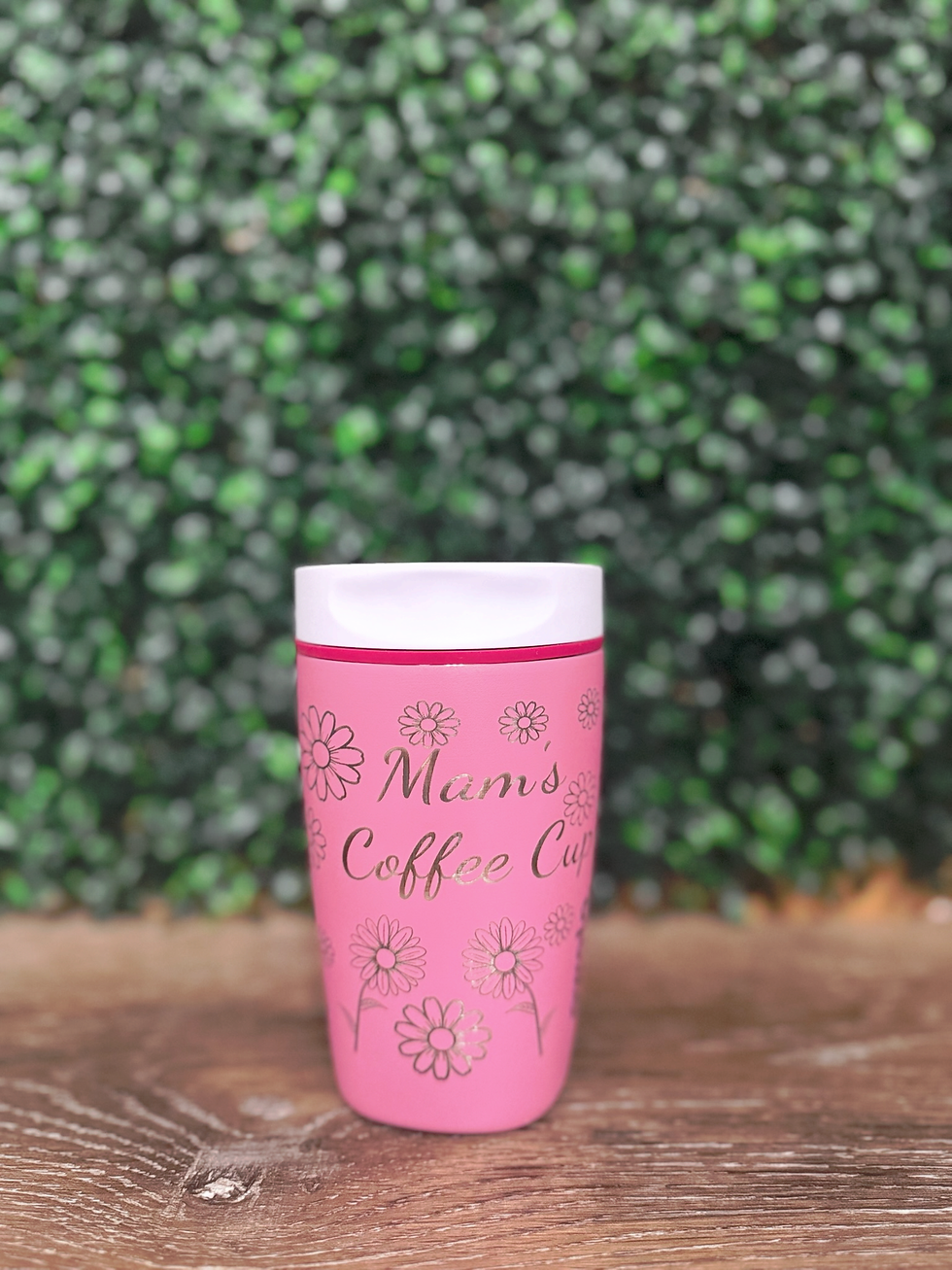 Close-up view of a stainless steel tumbler with custom engraving