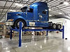 blue-semi-on-heavy-duty-lift-1024x768.jpg
