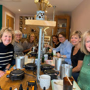 Group of friends making candles