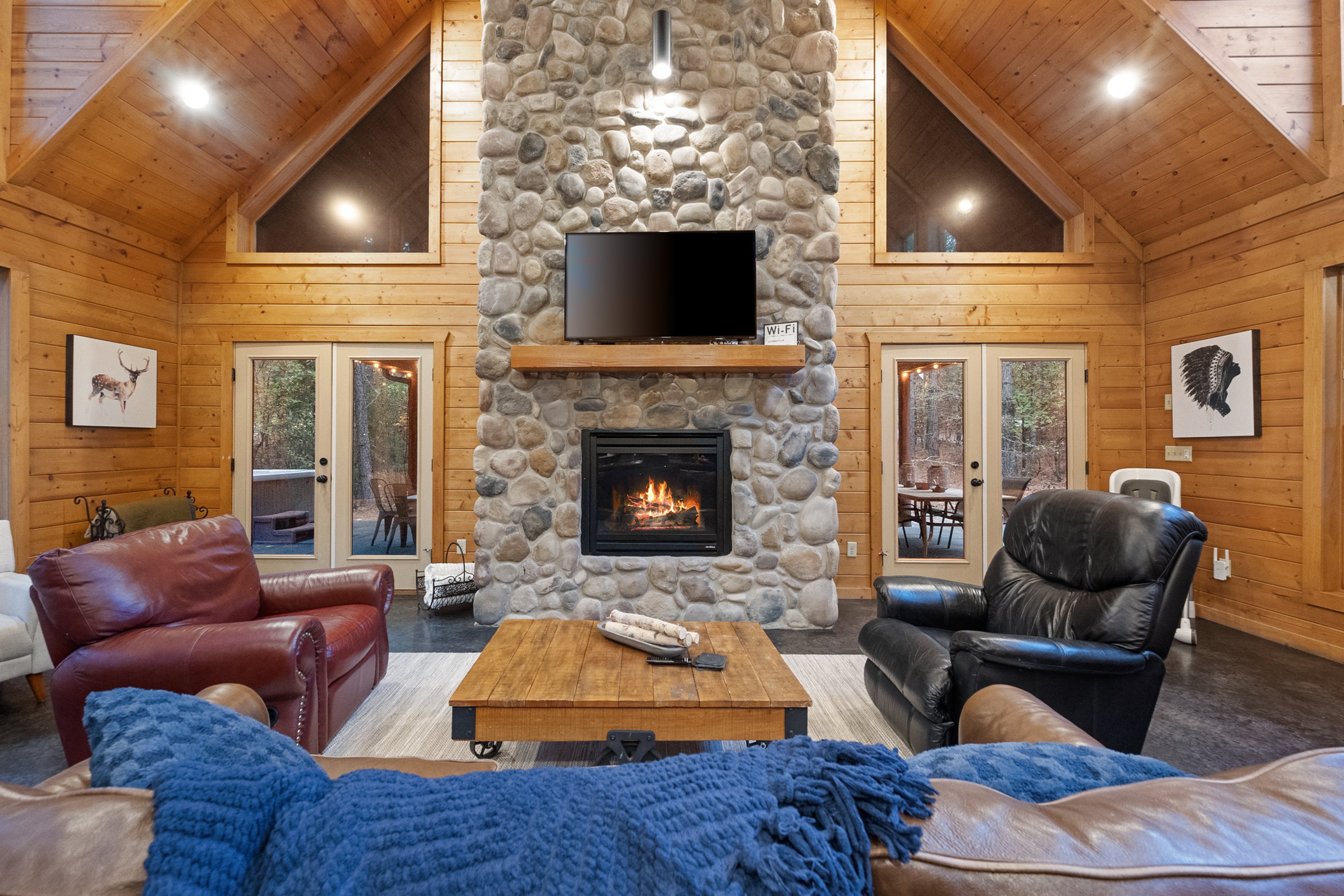 Cozy cabin living room with roaring fireplace