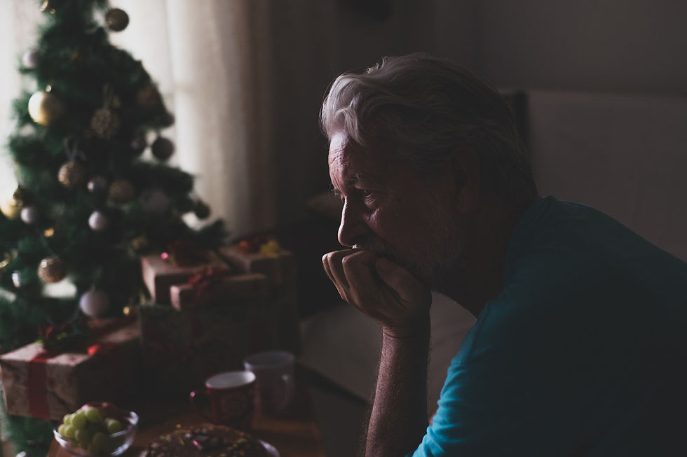 Isolated elder grandfather sitting alone during the holidays.
