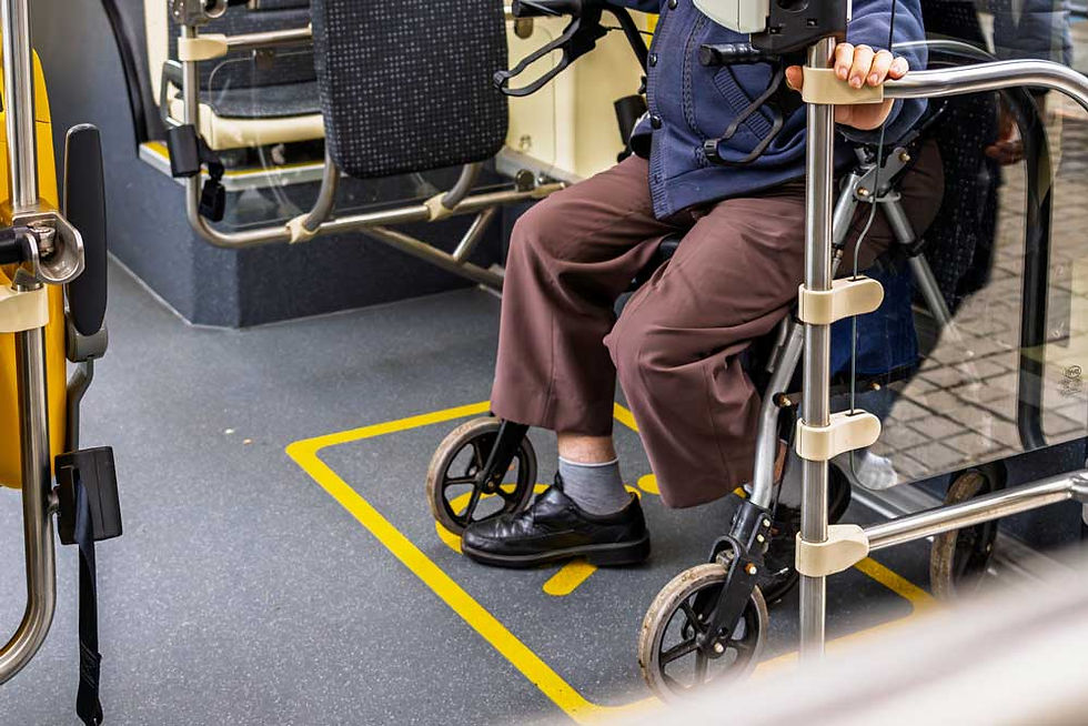 Senior passenger using a walker on a city bus.