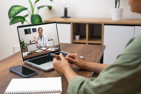 online trans healthcare appointment, laptop call.jpg