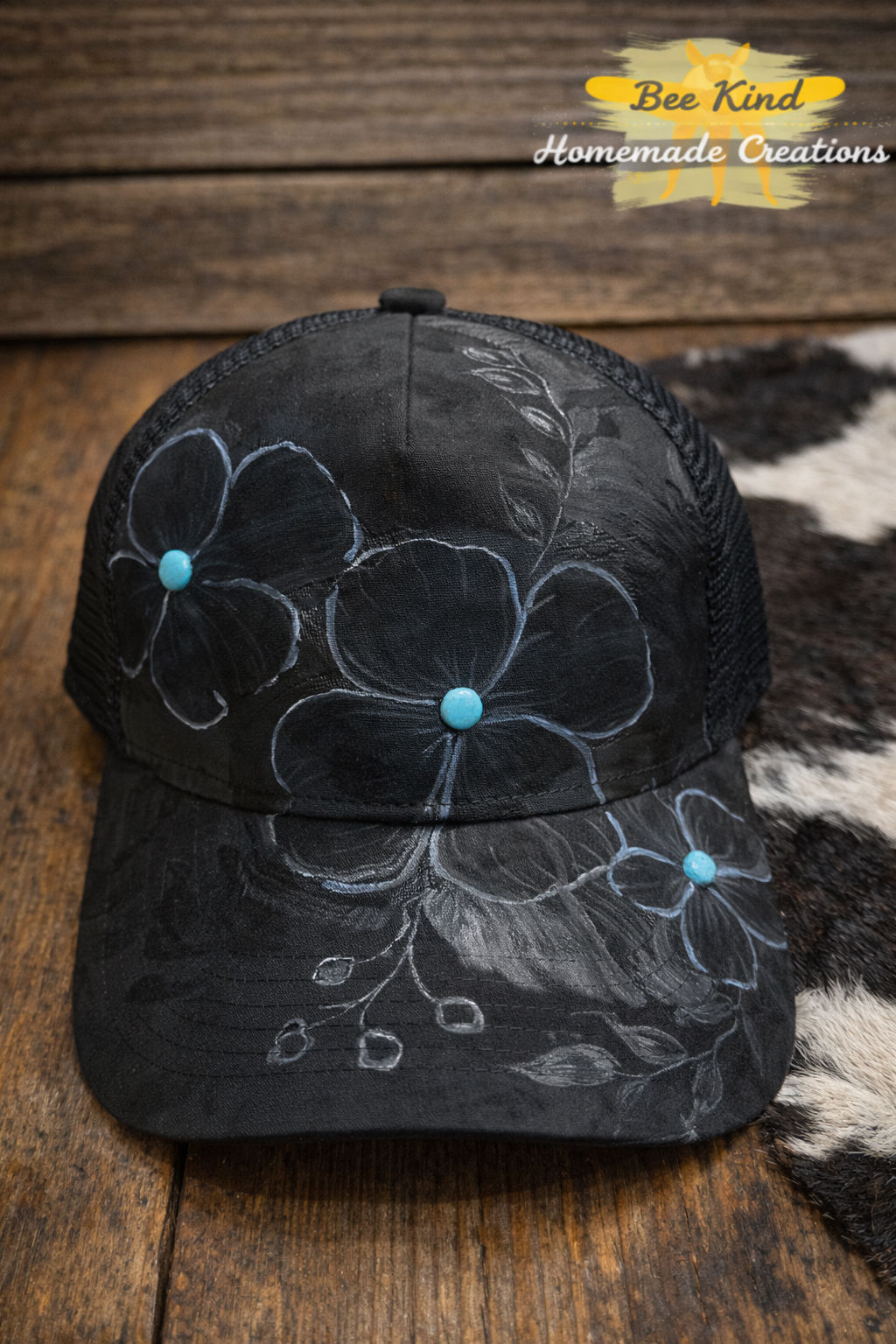 Black suede trucker hat with flowers and turquoise 