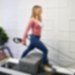 Kim Repp on the Pilates Reformer machine