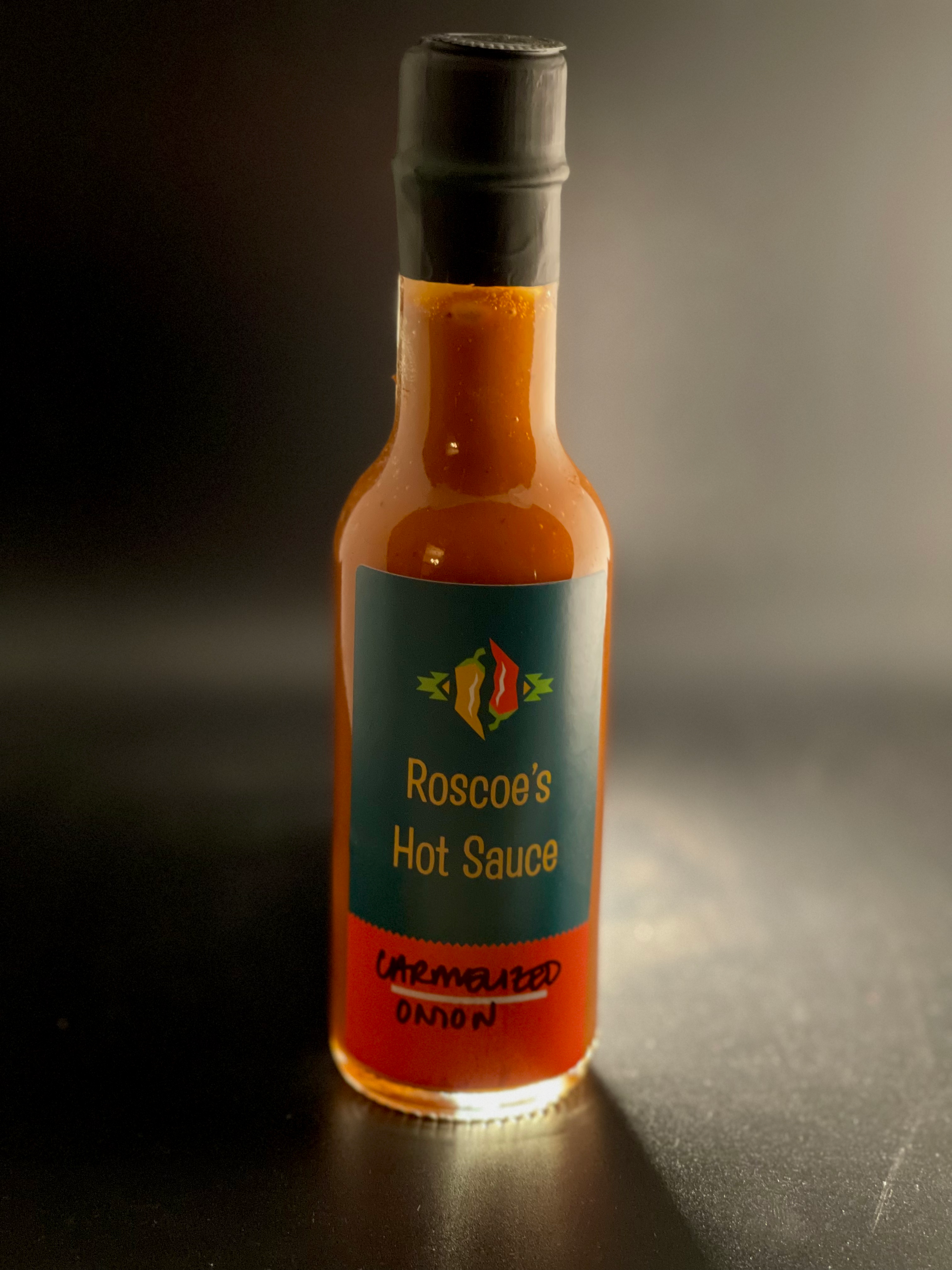 Bottle of caramelized onion hot sauce. small