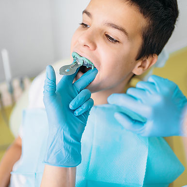 female-dentist-makes-teeth-impression-ER