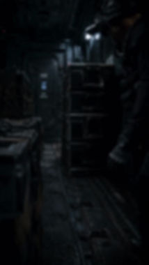 Shadowy figures and stacked equipment cases fill a dim industrial passage.